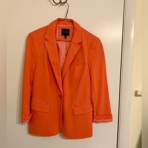 Orange 3/4 sleeve light business jacket.